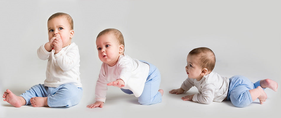 Thrre babies: sitting, crawling and laying