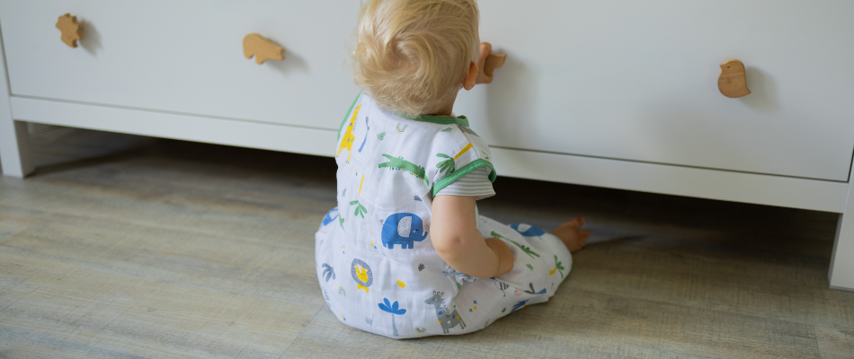 baby wearing 0.5 TOG summer sleeping bag with feet